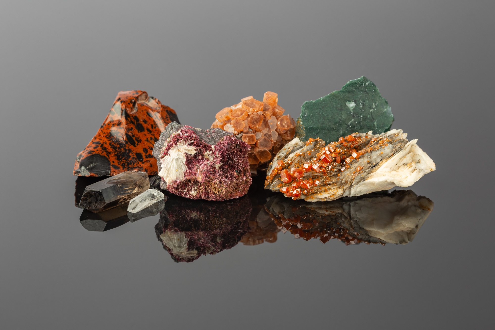 Group of Stones and Minerals on Reflective Surface